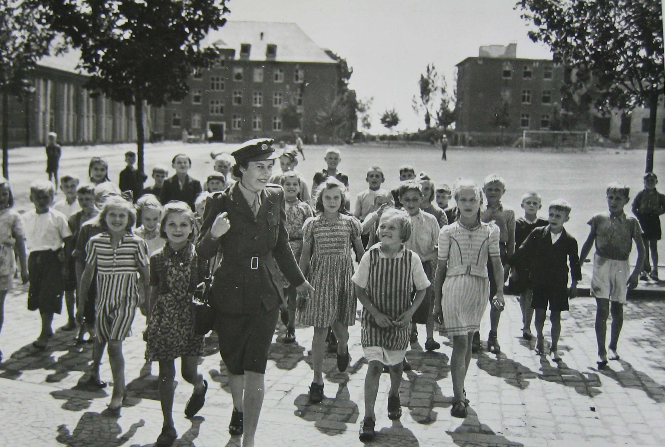 UNRRA welfare worker with children at the UNRRA Weisbaden Camp, postwar